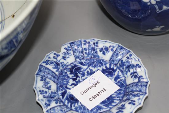 A large Chinese blue and white bowl, 29.5cm a prunus jar, height 12cm and a Kangxi blue and white fluted saucer, 11cm